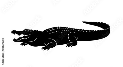 Black silhouette of a powerful alligator with open jaws.