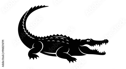 Black silhouette of a powerful alligator with open jaws.