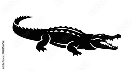 Black silhouette of a powerful alligator with open jaws.