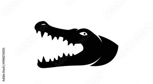 Alligator head with open mouth and sharp teeth in black and white.