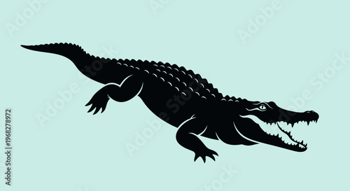 Silhouette of a menacing alligator or crocodile swimming with open jaws.