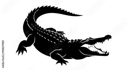 Powerful black silhouette of a menacing crocodile with open jaws.