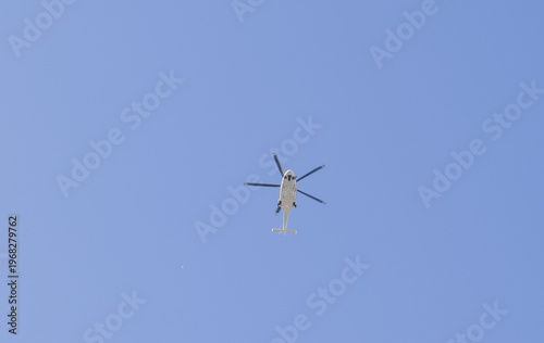 A helicopter is flying in the sky