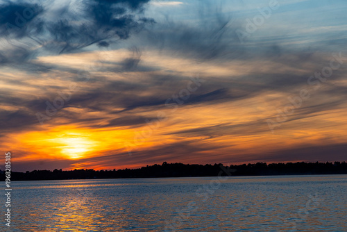 Colorful sunset over the lake. Mietkowski Lake, Poland