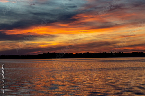 Colorful sunset over the lake. Mietkowski Lake, Poland