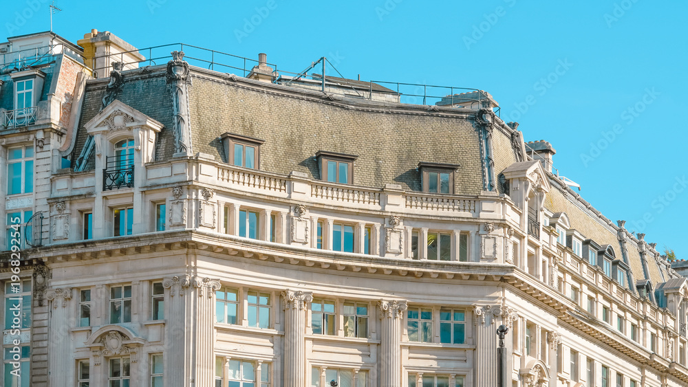 Fototapeta premium Historic building with ornate architecture under clear blue sky