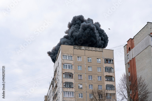 The moment of the explosion. Thick black smoke rises above the building with sparks of hot metal. The explosion was from an Iranian-Russian drone 