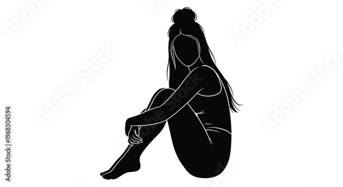 A woman sits with knees drawn up in a dark silhouette