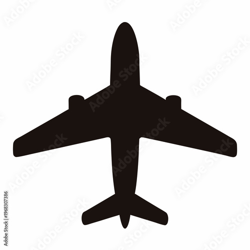 Silhouette of an airplane viewed from above in black and white