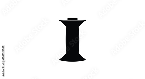 A stark black silhouette depicts a film reel spool isolated against a plain white background