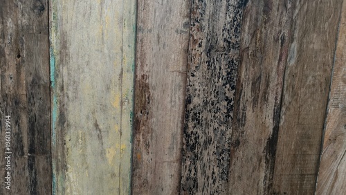 Weathered wooden plank texture with stains and mold. Rustic vintage background and natural surface concept.