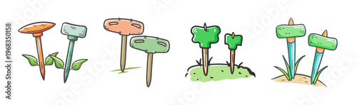 Assorted garden stakes with labels for plants and vegetables in a garden setting