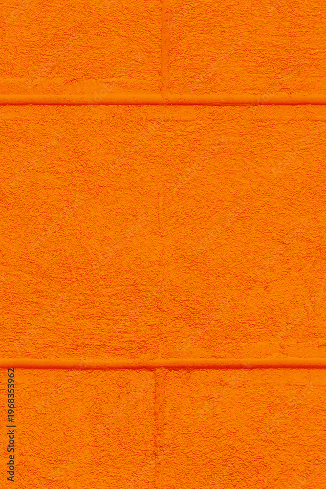 Fototapeta premium Part facade house painted wall brick blocks orange paint exterior architecture home background