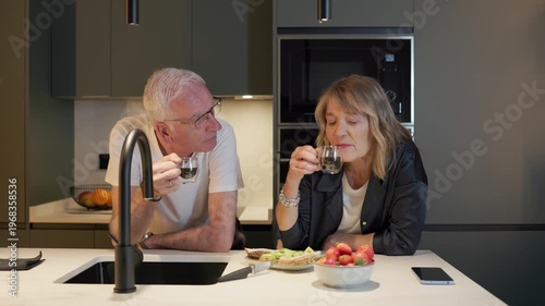 Senior couple enjoying healthy breakfast in kitchen
