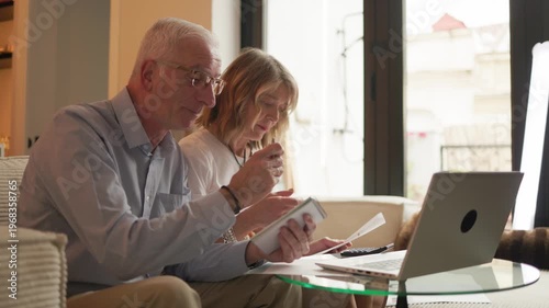 Senior couple calculating retirement financial budget and savings