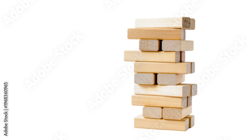 Canvas Print Tall stack of light-colored wooden Jenga blocks, carefully balanced and isolated