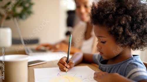 Child drawing with colored pencils at home while a parent works on a laptop in the background.