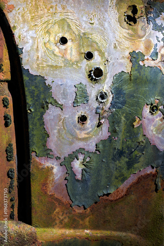 Bullets holes in an old car