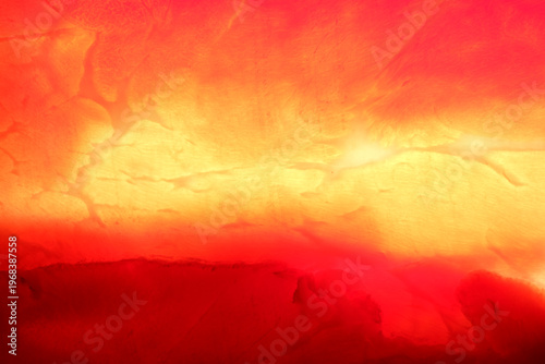 Vibrant sunset glows in fiery hues over the tranquil horizon