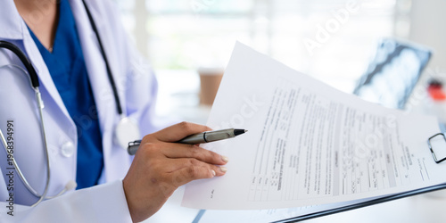 Schilderij op canvas Healthcare, doctor woman in office, writing and clipboard with insurance, schedule and reading