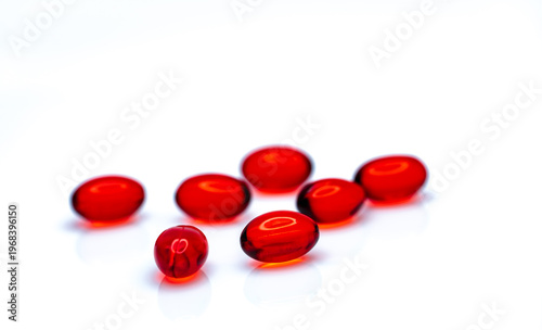 Obraz na płótnie Red soft gel capsule pills isolated on white background