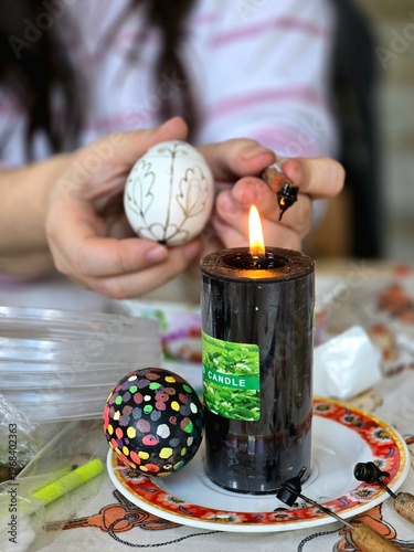 Easter eggs and candle. The color of eggs for Easter.