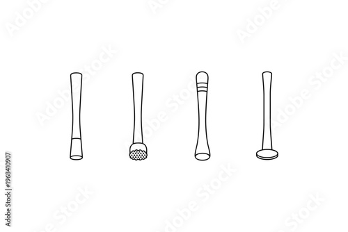 Collection of four different bar muddlers and pestles for cocktail preparation