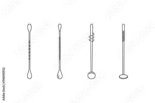 Collection of four bar spoons with different designs for mixing cocktails