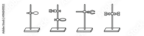 Various laboratory stands with clamps and rings for scientific experiments