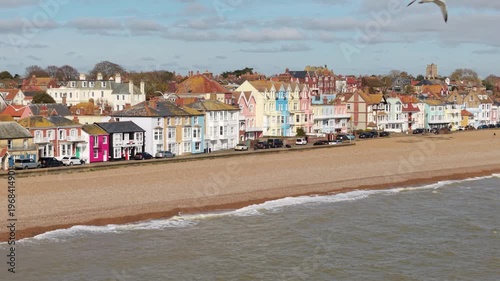 Aerial drone view of Aldeburgh seaside town featuring colourful houses and pebble beaches on the Suffolk coast UK