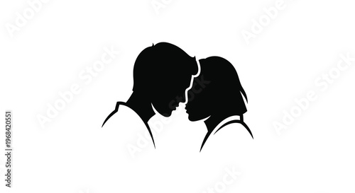 Couple embracing closely facing each other in a striking silhouette