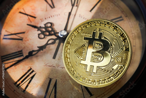 Gold Bitcoin coin on clock background, digital asset investment timing concept.