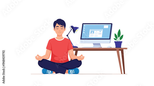 Calm young man sitting in a lotus pose meditating in front of his desktop computer to reduce stress while working.