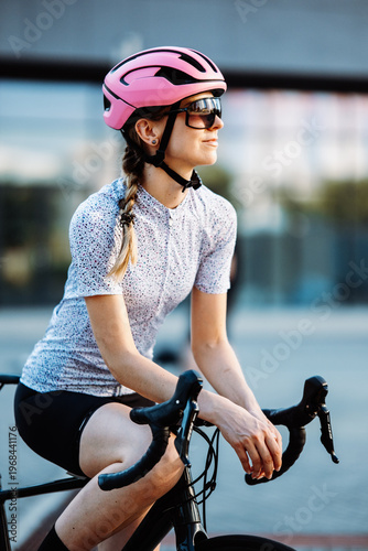 Smiling Woman With Bikewear. Relaxed Urban Woman Cyclist Showing Friendly Attitude With Braided Hair