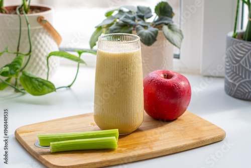 Green detox smoothie in the making. Apple, banana, celery
