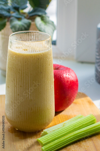 Green detox smoothie in the making. Apple, banana, celery