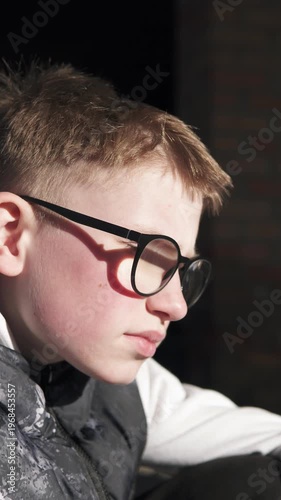A teenage boy sits alone on an abandoned construction site after school, looking sad and pensive. The atmosphere conveys themes of bullying, loneliness, and emotional struggle in an urban environment.