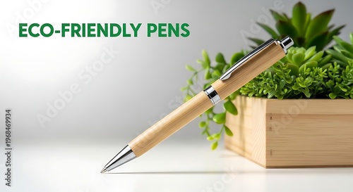 Bamboo pen with silver tip and clip on white table next to plant pot