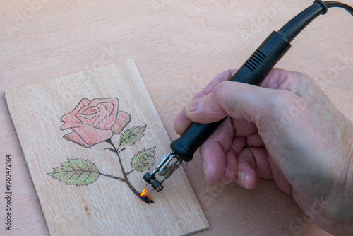 Wood burning a rose using a pyrography pen