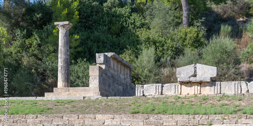 Ancient Column and Stone Ruins on Terraced Hillside in Olympia