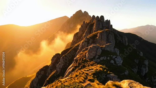 a sunlit mountain ridge with light haze drifting slowly, cinematic natural tones 