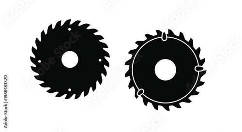 Two black circular saw blades shown in a stark silhouette