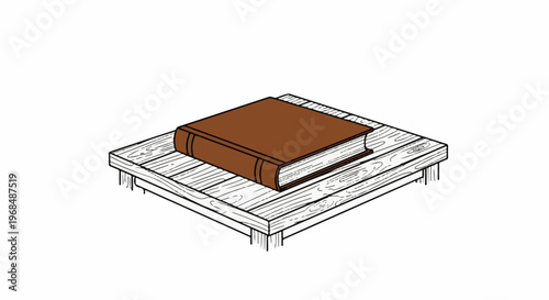 A brown book rests on a wooden surface with visible grain