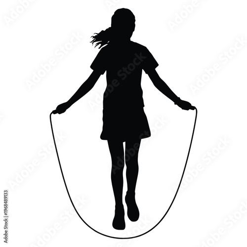 A young girl joyfully jumps rope in a dynamic pose presented as a striking silhouette