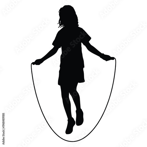 A young girl joyfully jumps rope in a dynamic pose presented as a striking silhouette