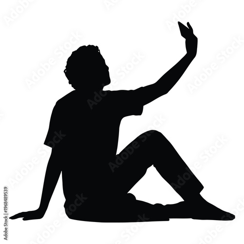 A person is seated and taking a self portrait with their mobile phone silhouette