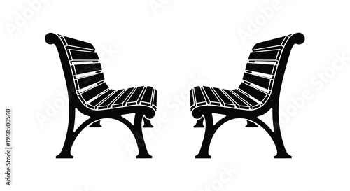 Two ornate park benches facing each other a striking silhouette