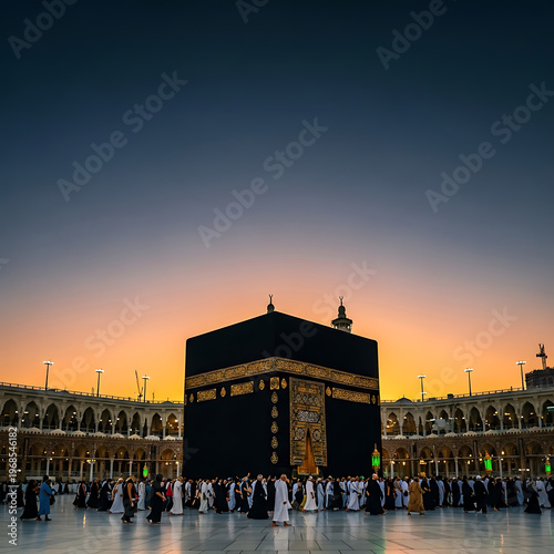 Pilgrims gather near the Kaaba at dusk with a beautiful sunset sky.