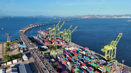 Aerial View of Docks Area Full of Containers in Rio de Janeiro City Port and The Bridge To Niteroi Crossing Guanabara Bay