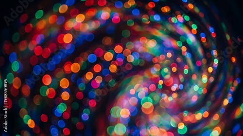Colorful bokeh lights in a swirling pattern against a dark background
